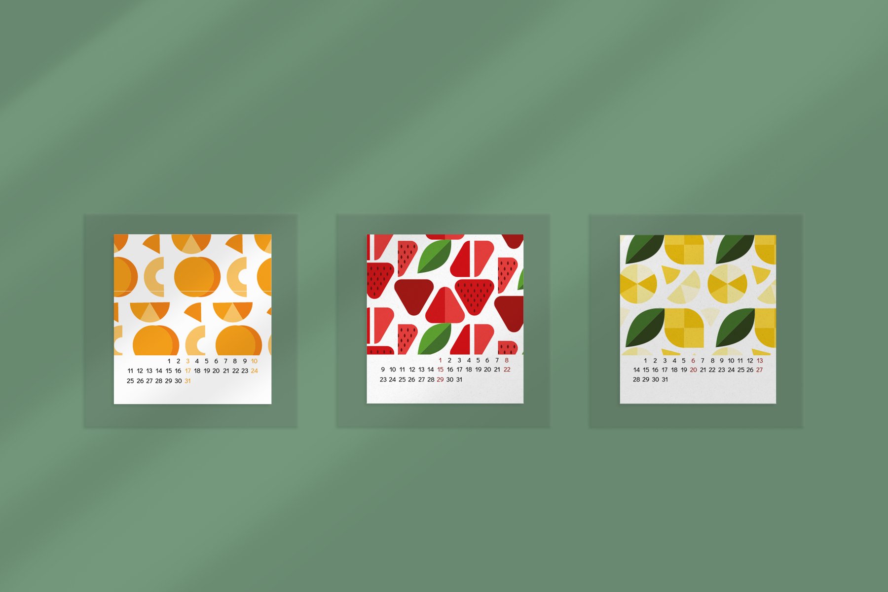 Three months of the 2022 calendar on a green wall