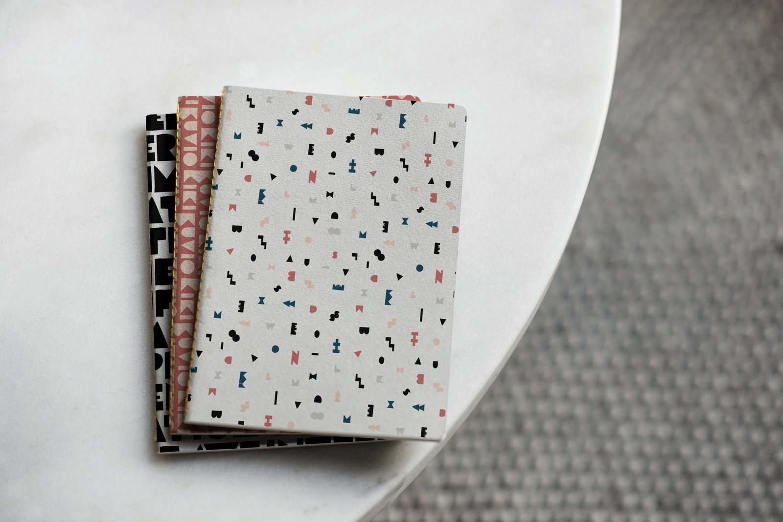 Stack of notebooks with confetti covers