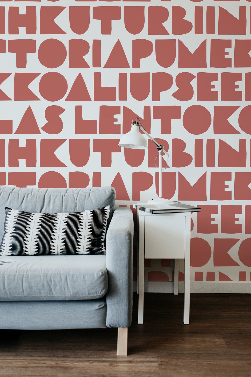 Wallpaper with a large word pattern in berry red