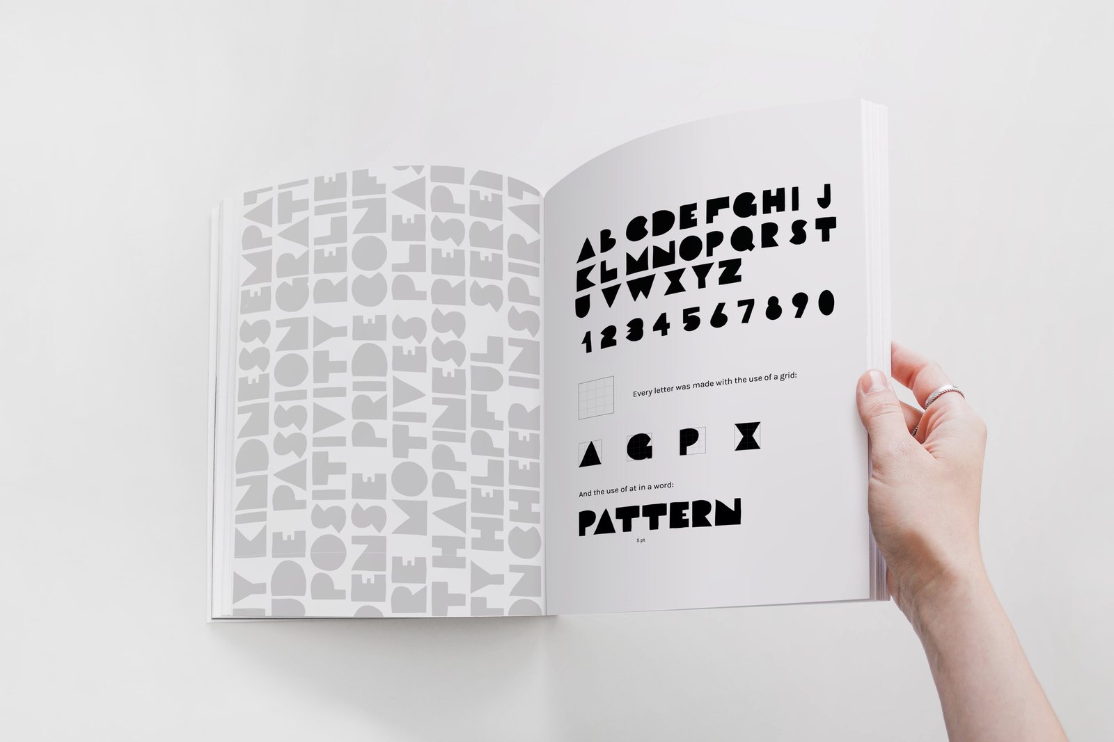 Open brochure spread showing the alphabet