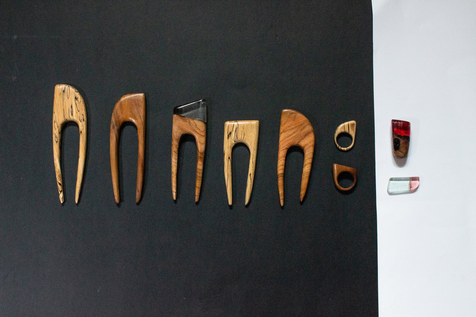 A row of wood and resin hairpins