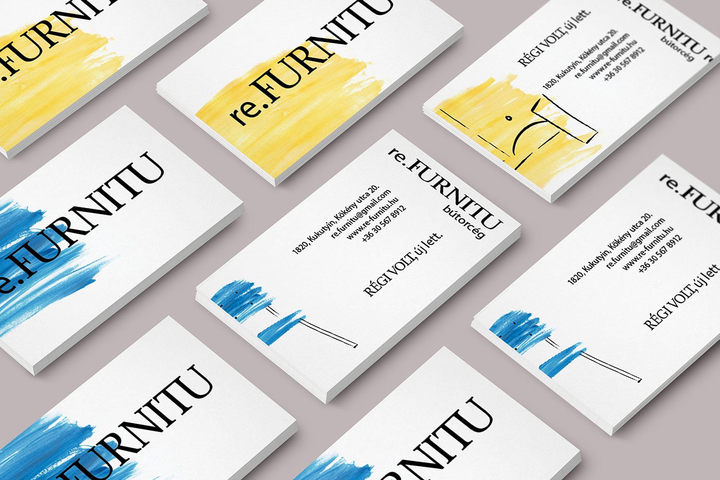 Business cards in blue, yellow and white with brush strokes