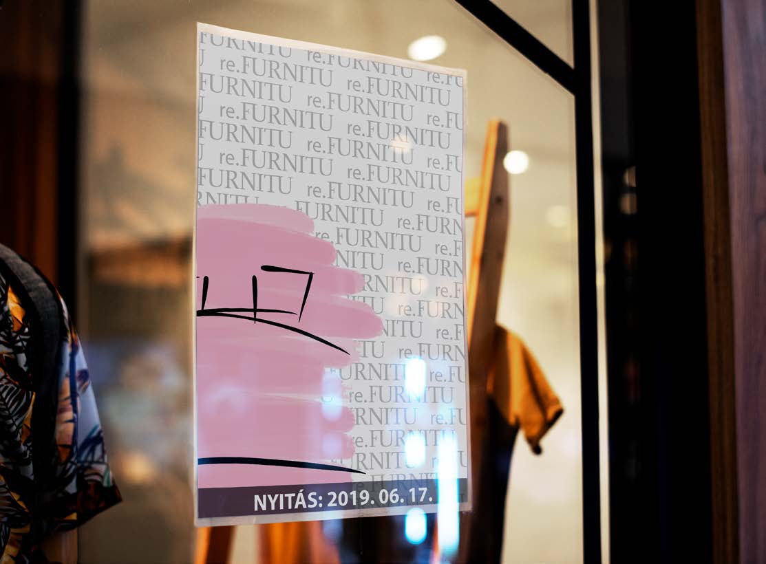 The pink bed poster in a shop window