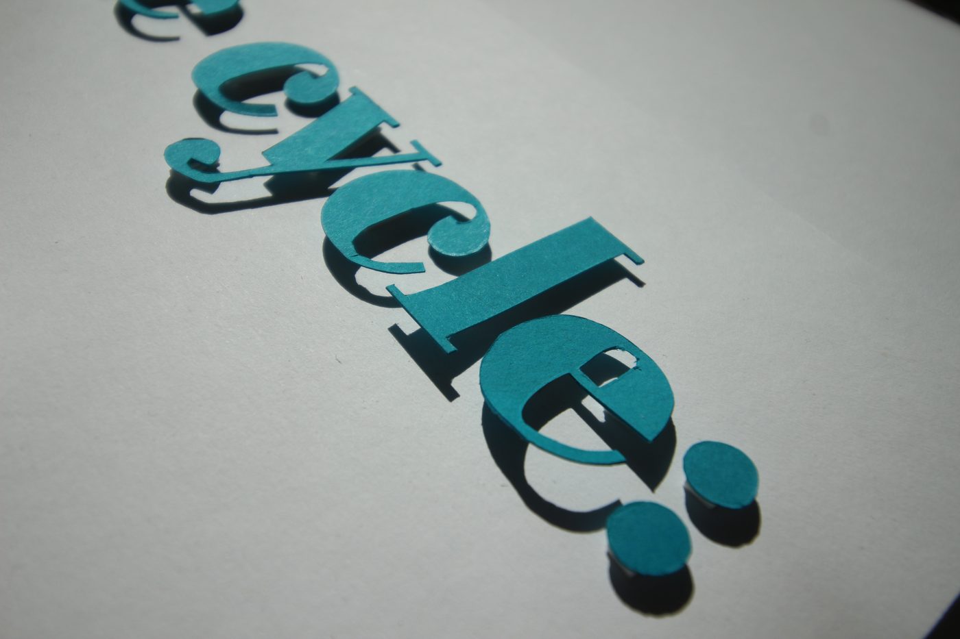 Close-up of the teal word cycle with its colon