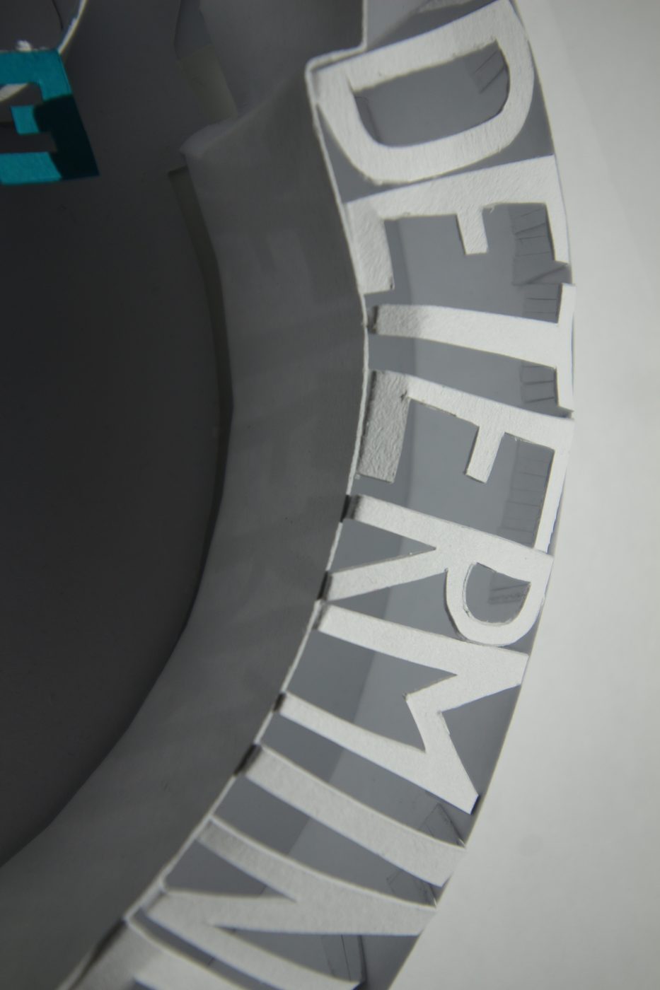 The word determined in white block letters standing in an arc